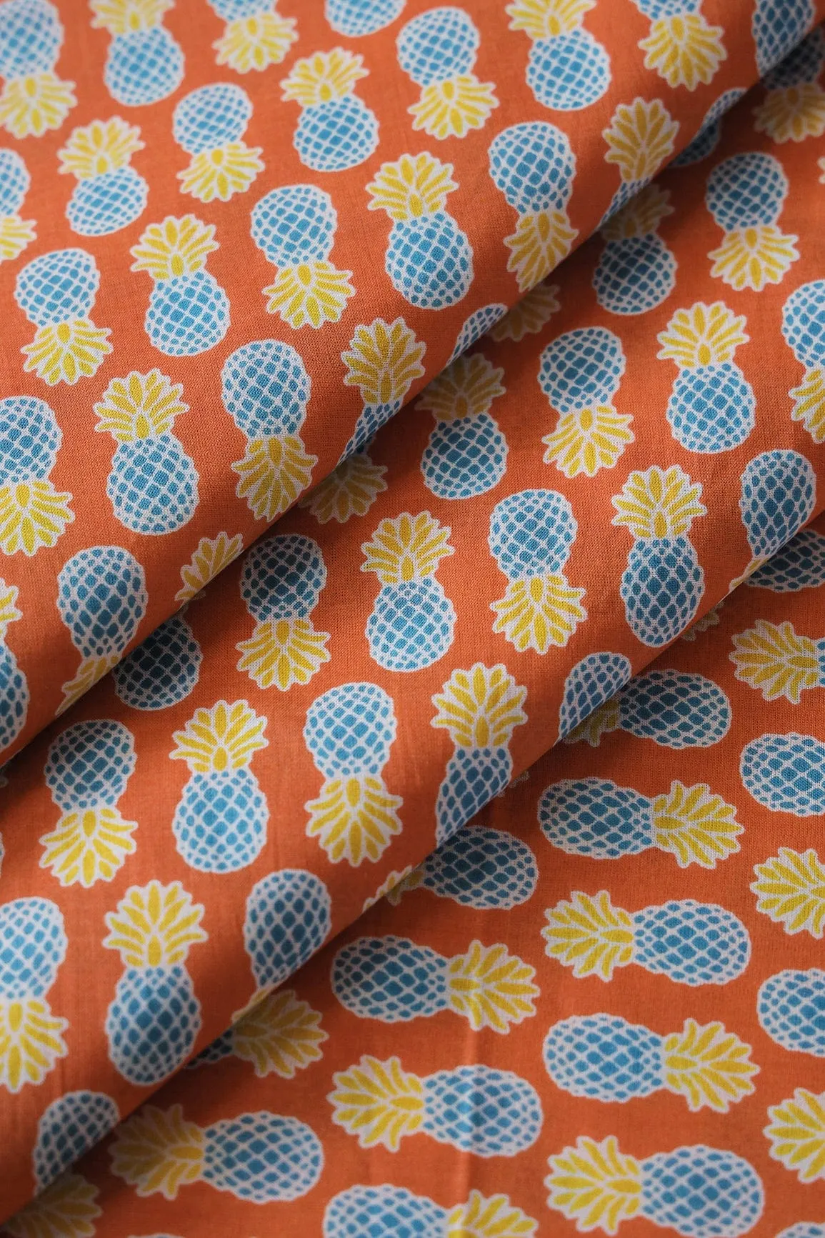 Orange And Blue Quirky Print On Pure Cotton Fabric